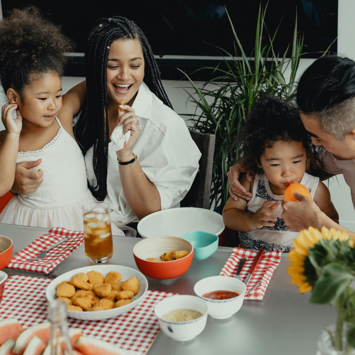 A family sharing a meal together around the table